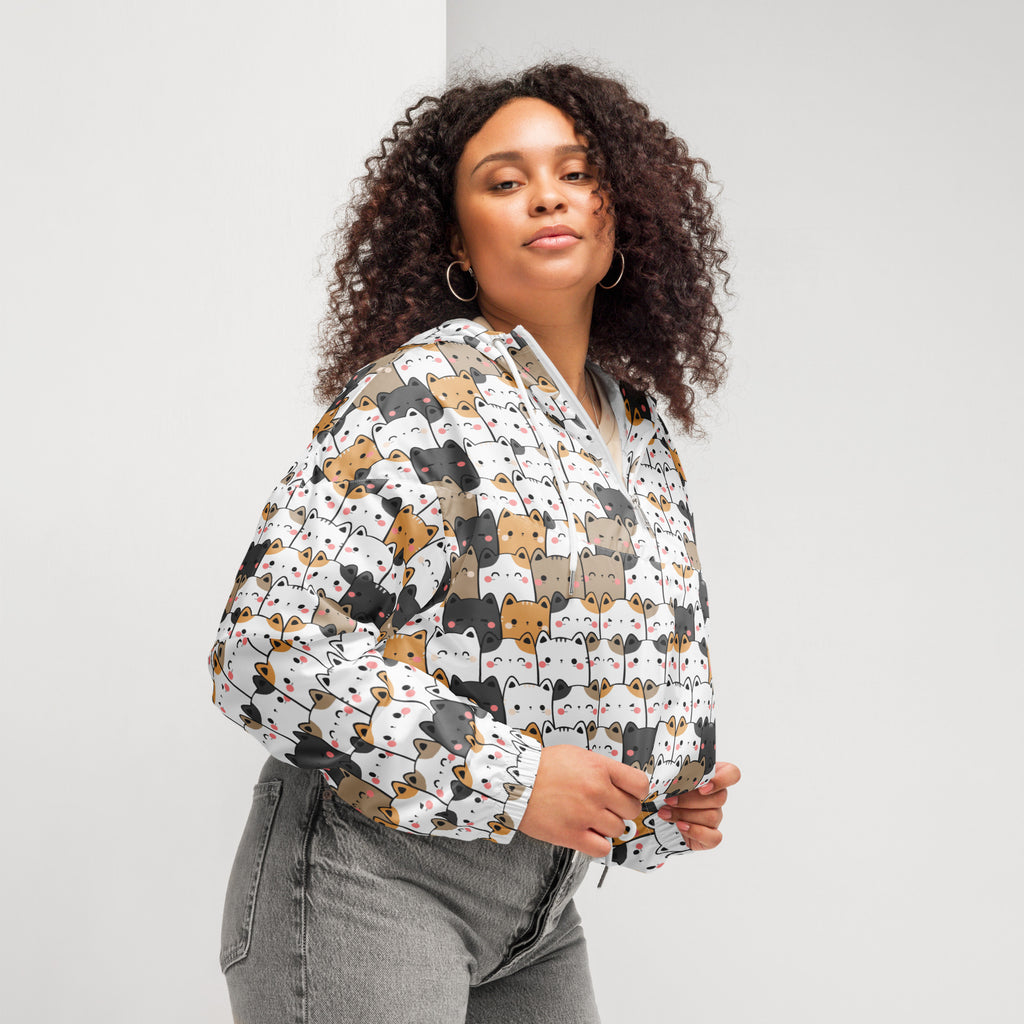 White cropped hoodie with playful multicolor cartoon cats in lightweight water resistant fabric with adjustable hood and pockets