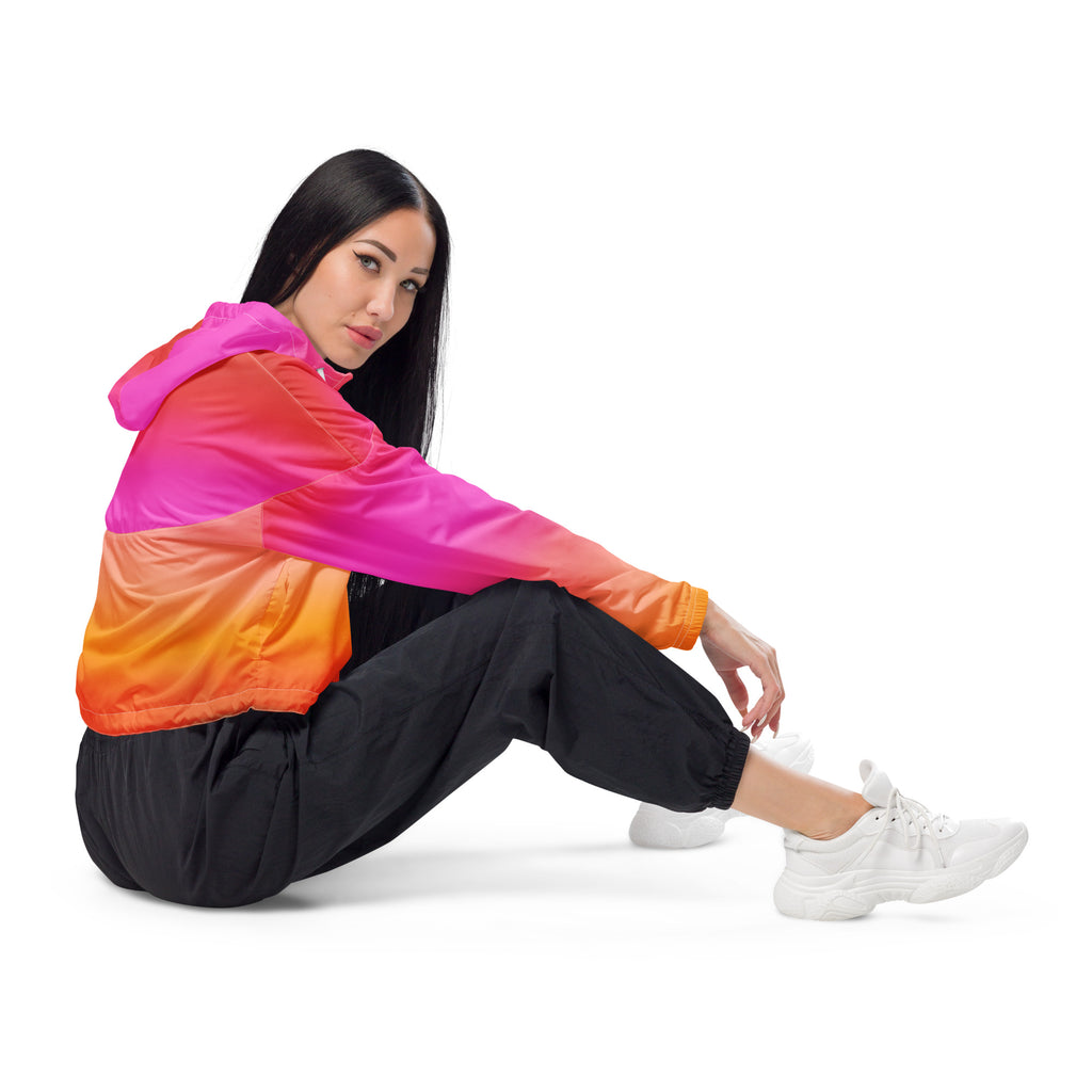 Women’s sunset ombre cropped windbreaker with pink orange and red panels in shiny nylon lightweight and water resistant