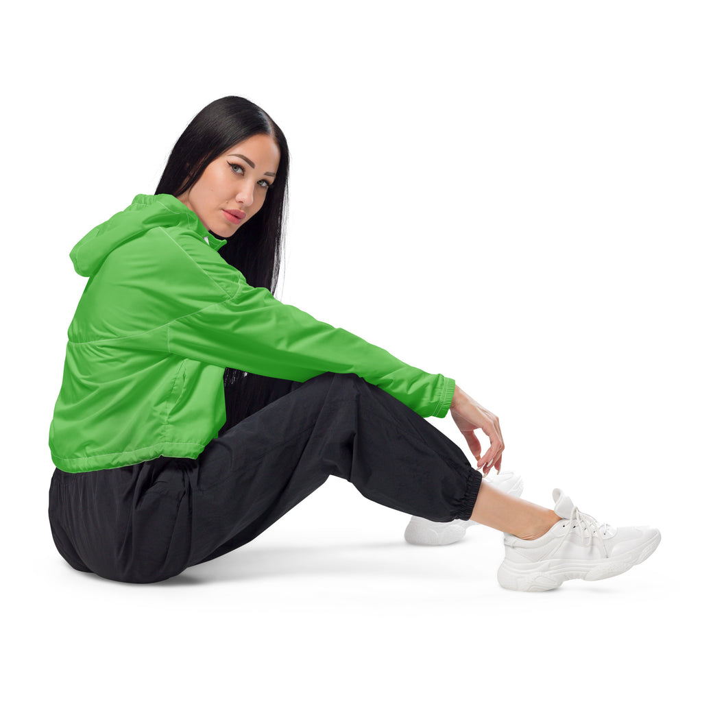 Women’s green cropped windbreaker with lightweight fabric adjustable hood and subtle seam detailing
