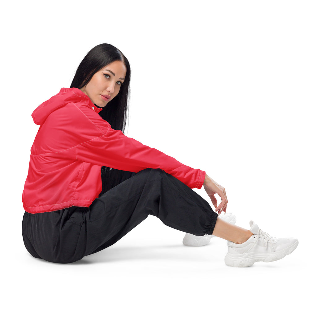 Women’s bright pink cropped windbreaker in vibrant red with lightweight fabric and subtle seam detailing