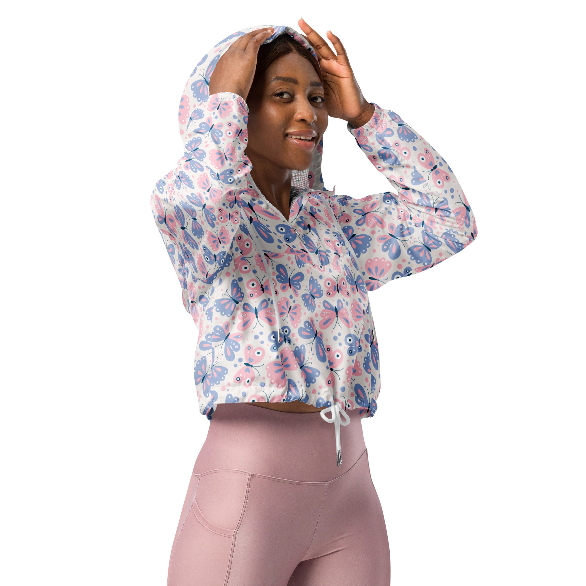 Women’s white cropped hoodie with playful pink and blue butterfly pattern, adjustable drawstring hood and long sleeves
