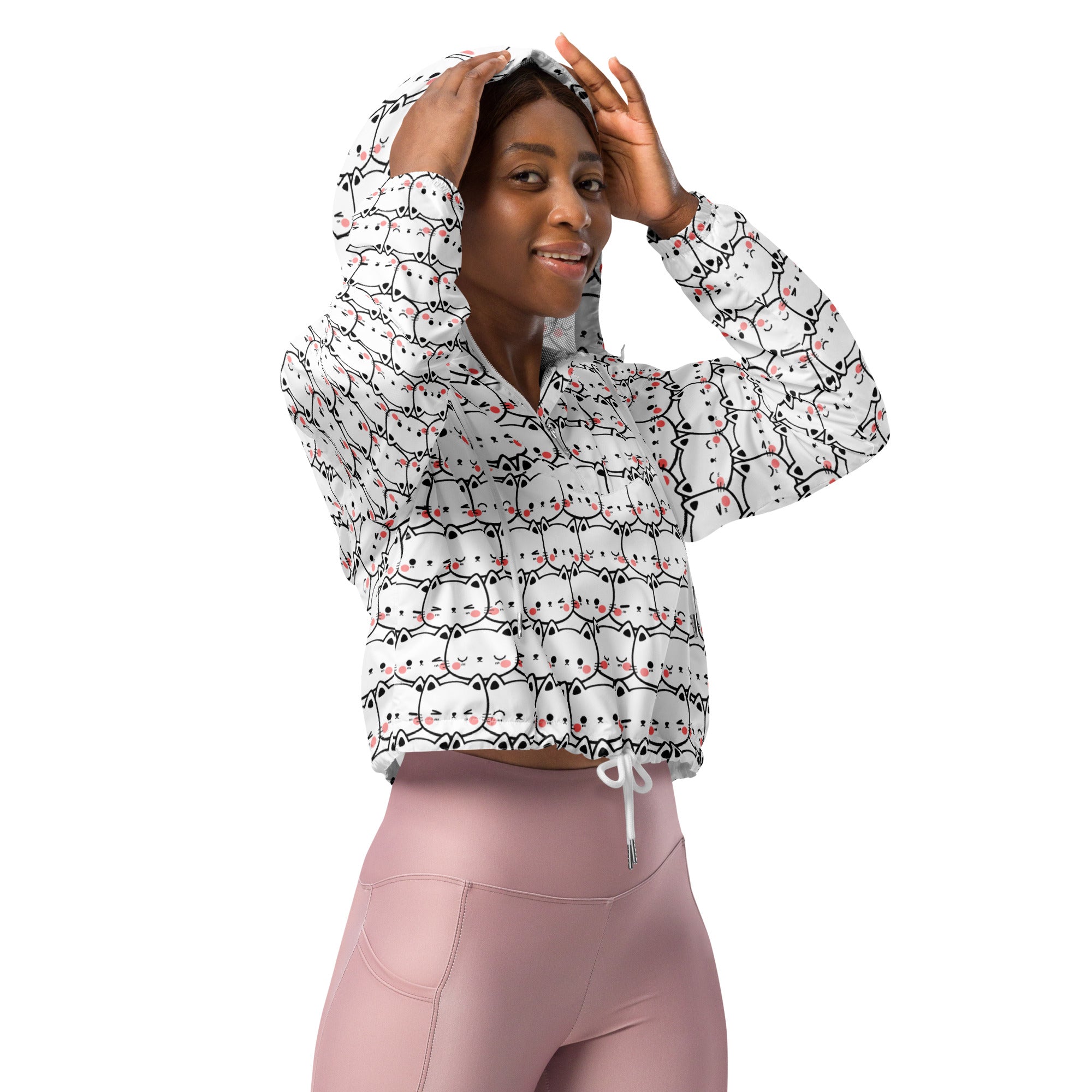 Women’s white cropped windbreaker with adjustable hood featuring playful black outlined cats with pink accents