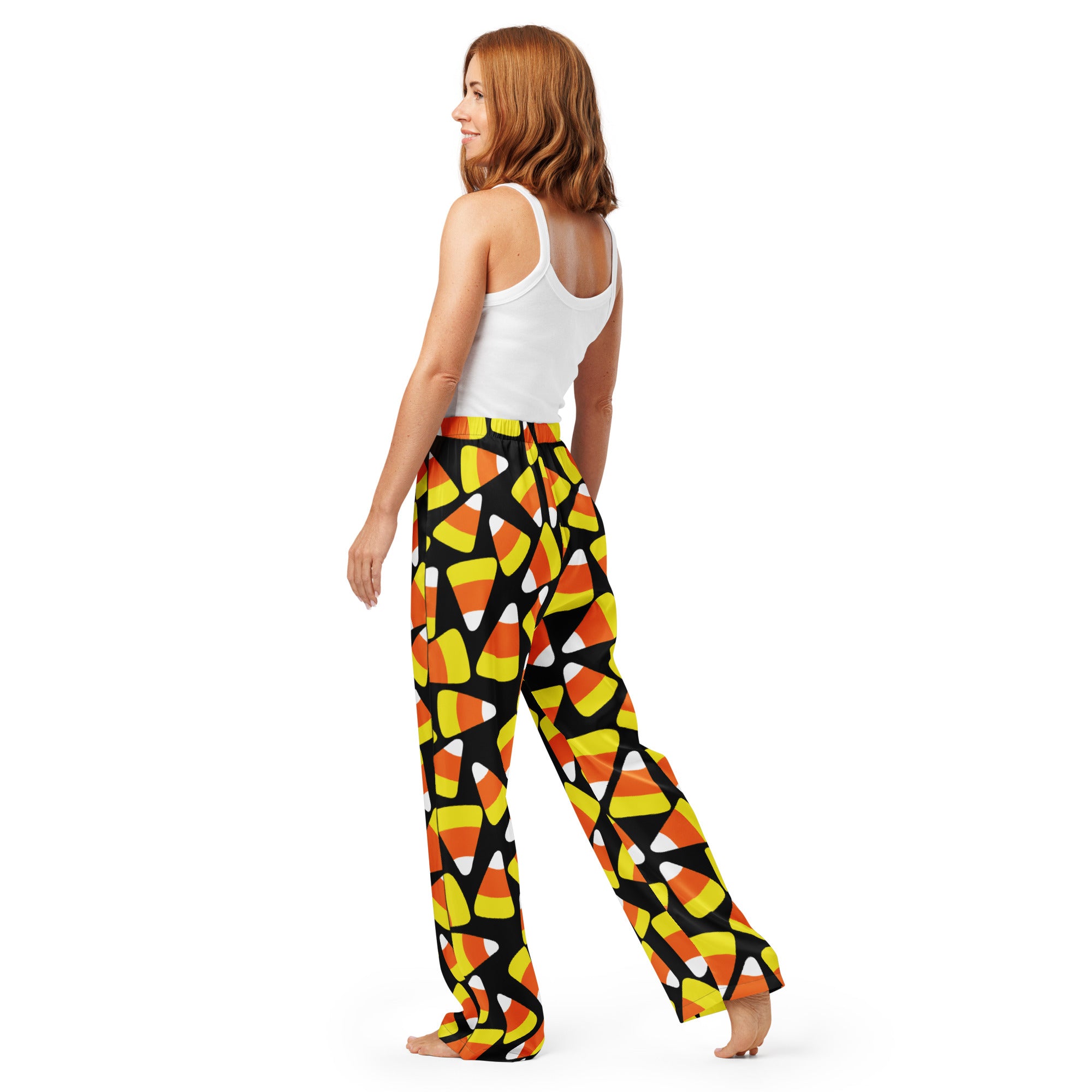 Women’s black lightweight relaxed fit pajama pants with candy corn pattern and drawstring waist for comfort