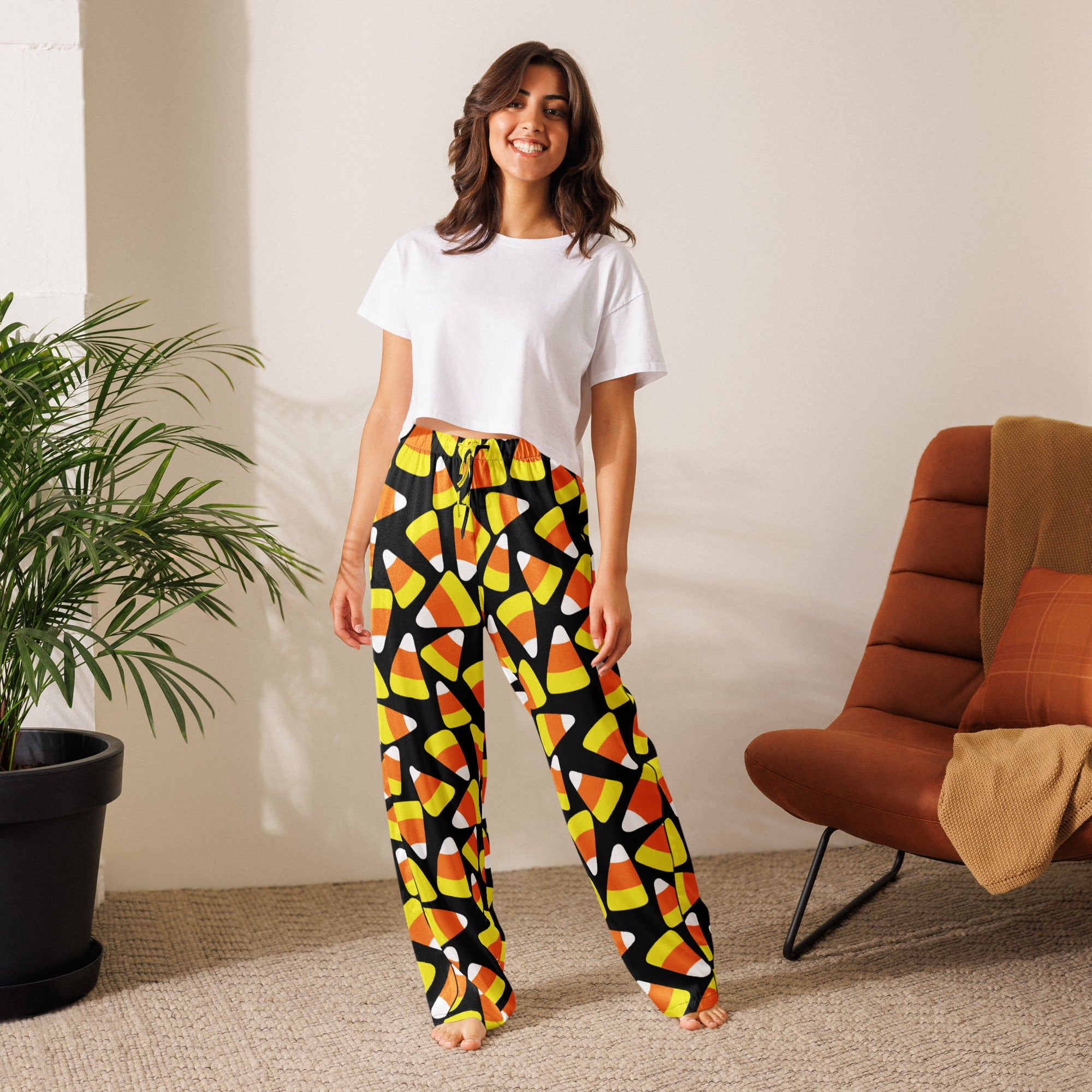 Women’s lightweight relaxed fit candy corn-patterned black pajama pants with drawstring waist for comfortable lounging