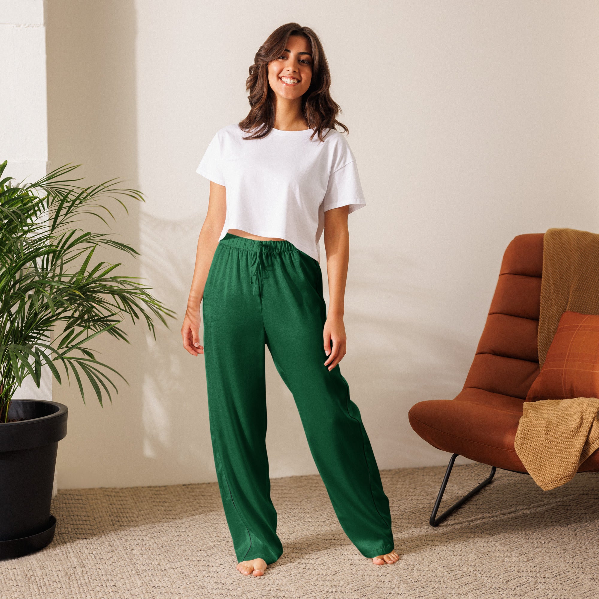 Emerald green satin women’s pajama pants with elastic waistband and drawstring for lightweight relaxed fit
