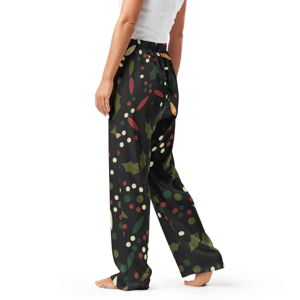 Women’s black holly print Christmas pajama pants with green leaves red berries multicolored dots lightweight relaxed fit
