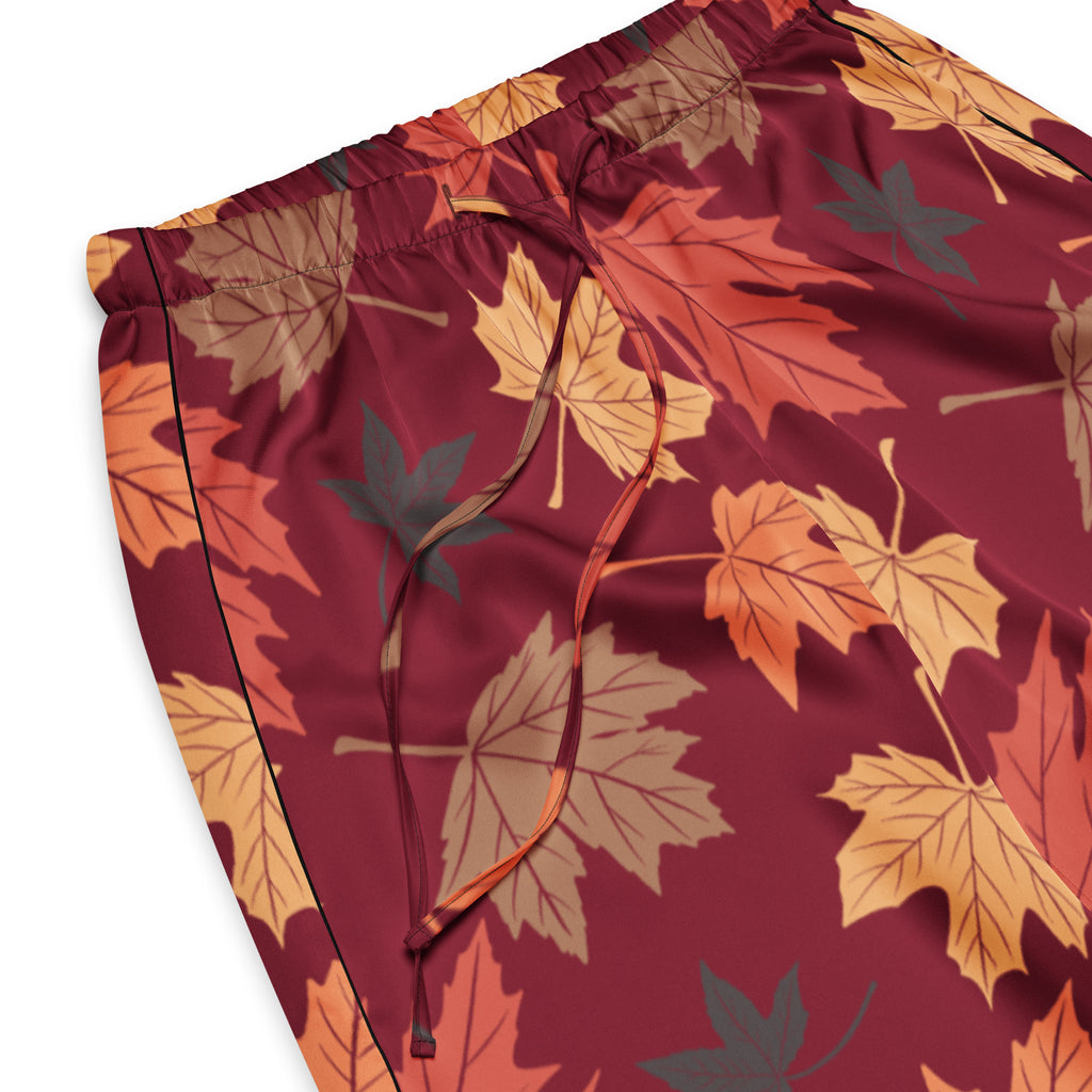 Women’s maroon lightweight pajama pants with vibrant autumn leaf pattern in orange yellow and brown and drawstring waist