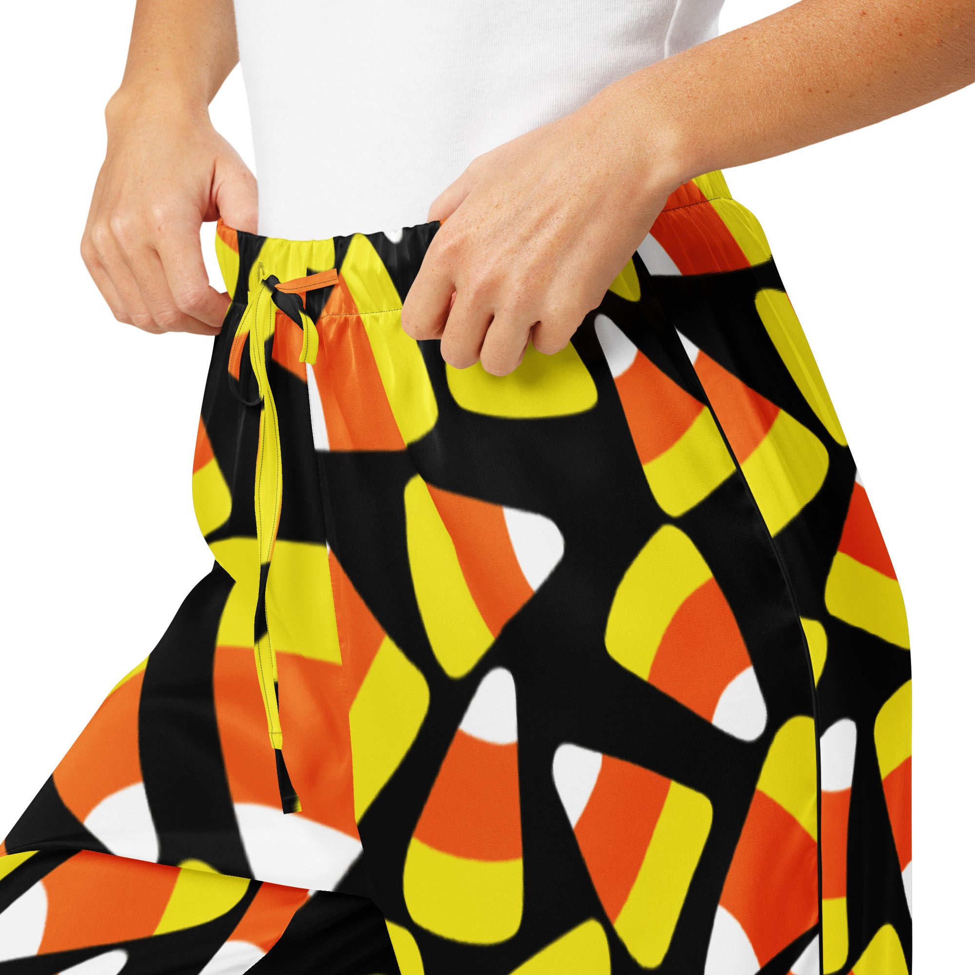 Women’s candy cane pajama pants with candy corn pattern in black orange yellow and white lightweight relaxed fit