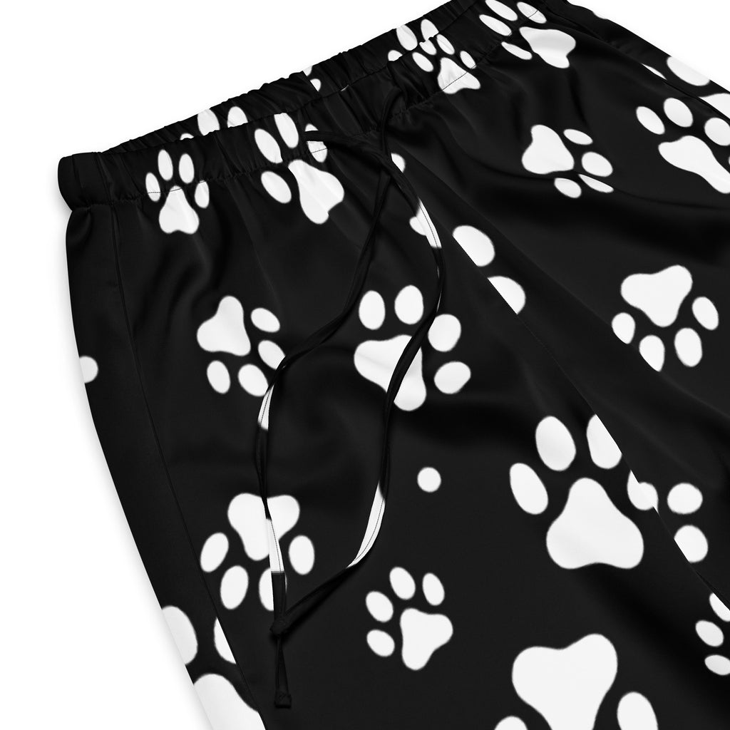 Women’s black lightweight paw print pajama pants with drawstring waist and relaxed fit featuring white paw prints