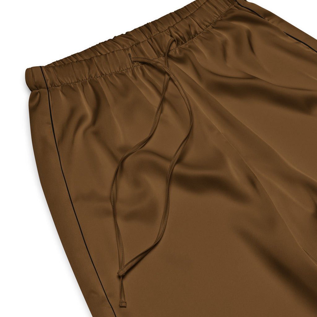 Women’s brown satin-like pajama pants with a drawstring waist and black side seam stitching for lightweight comfort