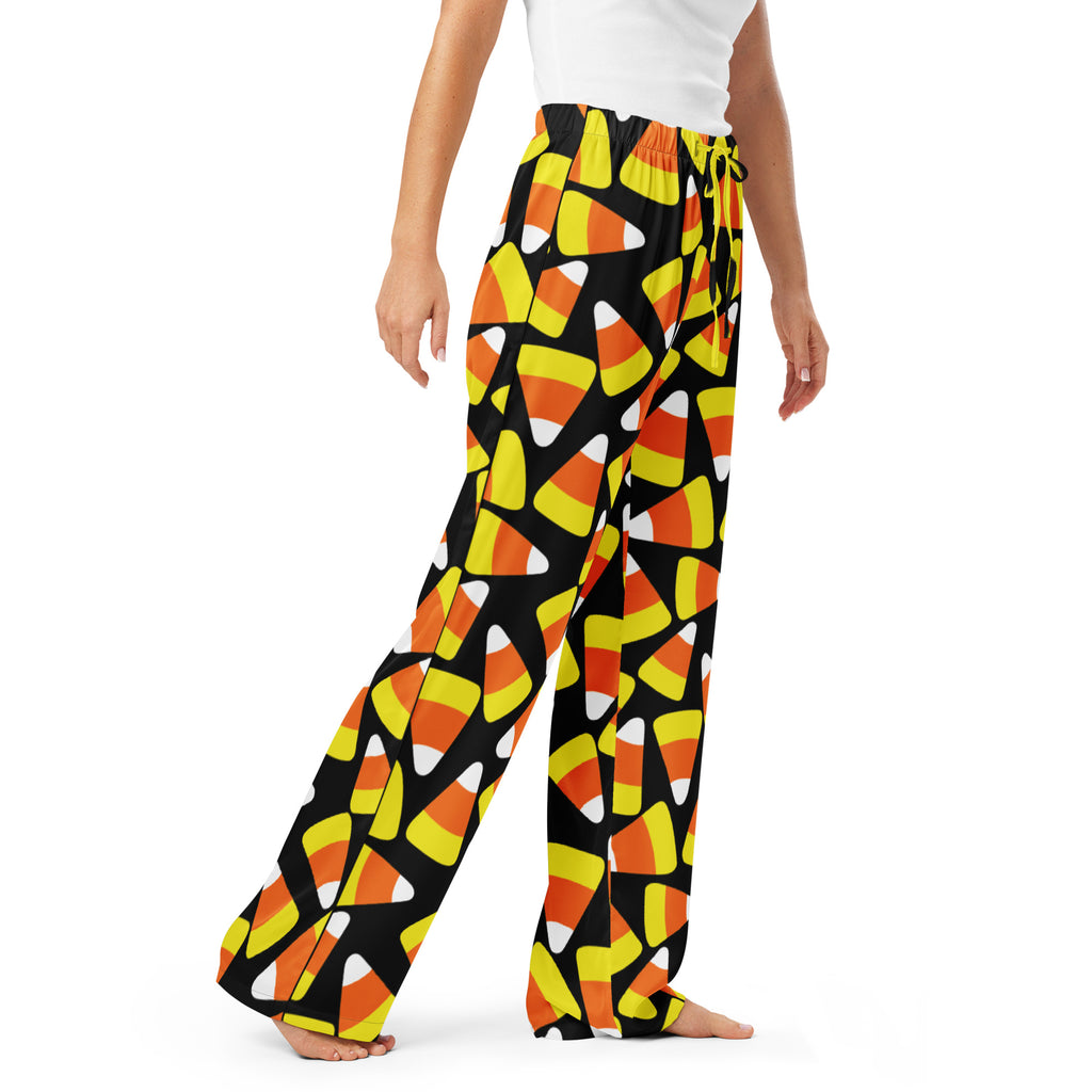 Women’s black lightweight candy cane pajama pants with drawstring waist and vibrant orange yellow white candy corn pattern