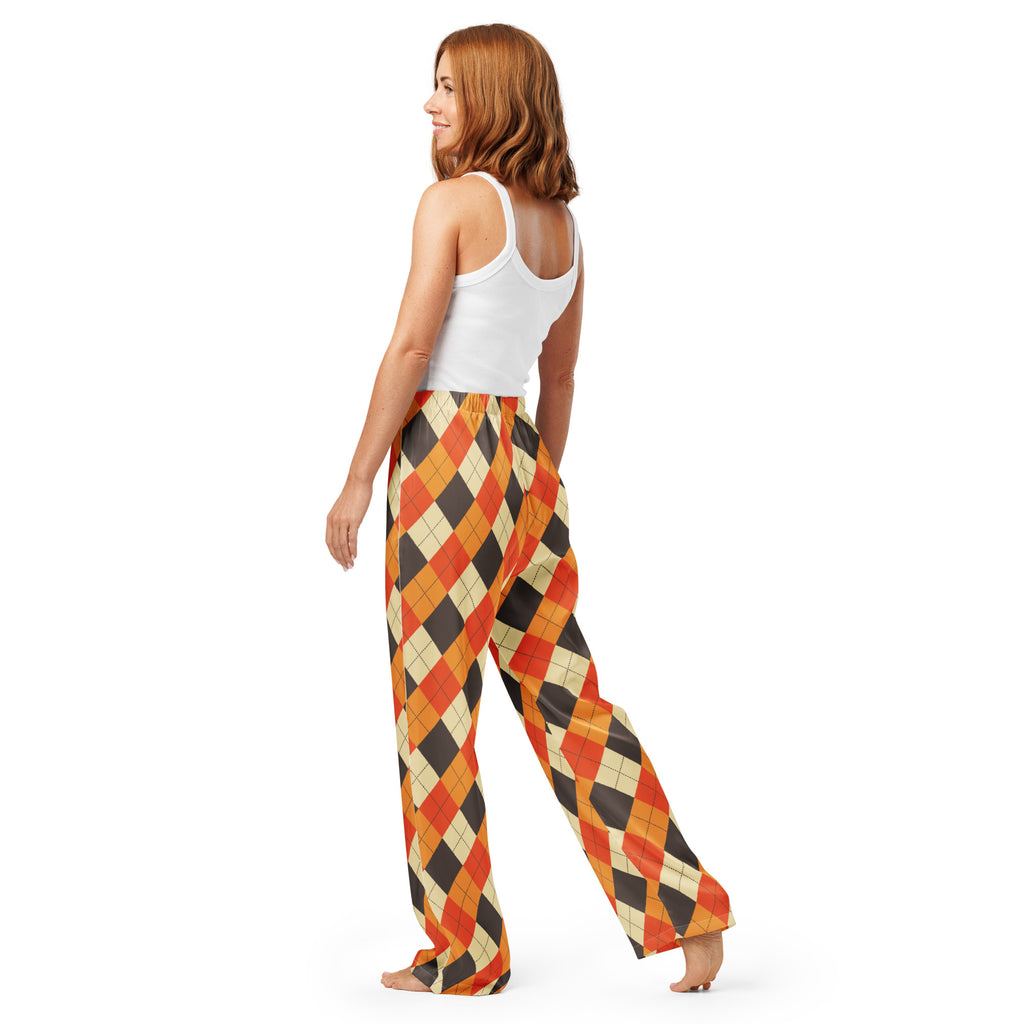 A pair of women’s fall argyle pajama pants with wide legs, bold orange black and cream pattern, lightweight relaxed fit with drawstring waist