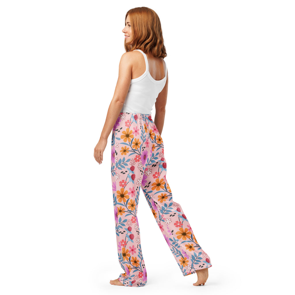 Women’s pink floral pajama pants with a lightweight relaxed fit drawstring waist and colorful orange blue and purple blossoms