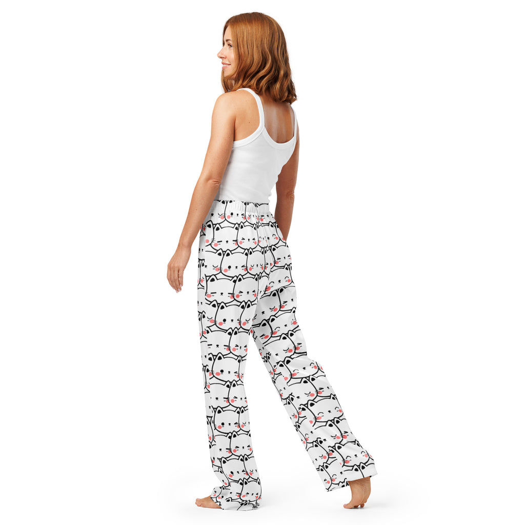 Women’s white lightweight pajama pants with black outlined cartoon cats and pink accents, relaxed fit with drawstring waist