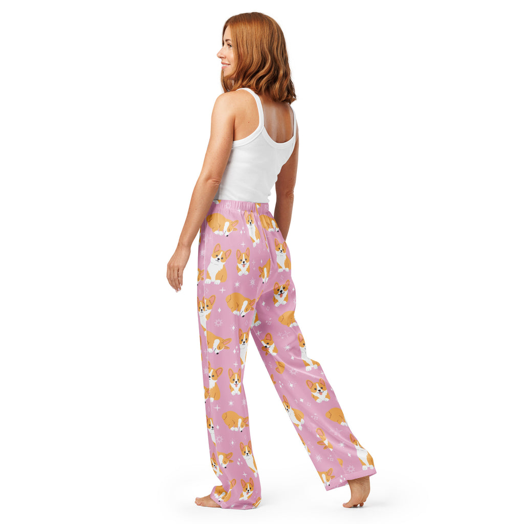 Women’s pink lightweight pajama pants with a drawstring waist featuring a playful tan and white corgi pattern