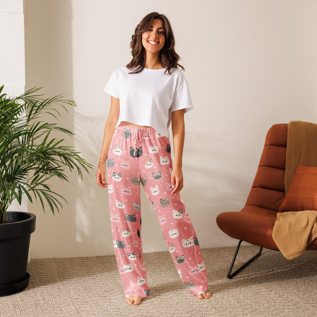 Women’s lightweight pink pajama pants with playful colorful cartoon cat faces and white polka dots and drawstring waist