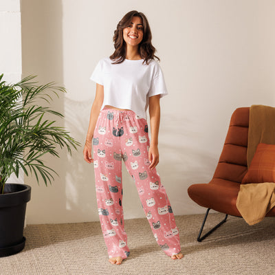 Women’s lightweight pink pajama pants with playful colorful cartoon cat faces and white polka dots and drawstring waist