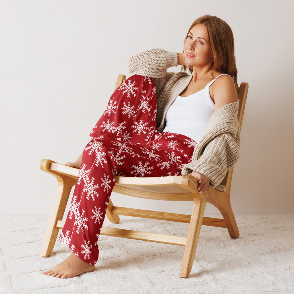 Women’s red lightweight pajama pants with white snowflake patterns and drawstring waist for relaxed fit comfort