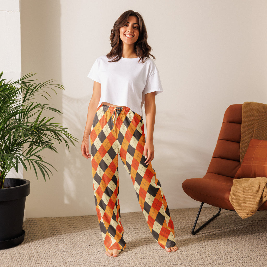 Woman wearing lightweight relaxed fit women’s fall argyle pajama pants in orange black and cream with drawstring waist