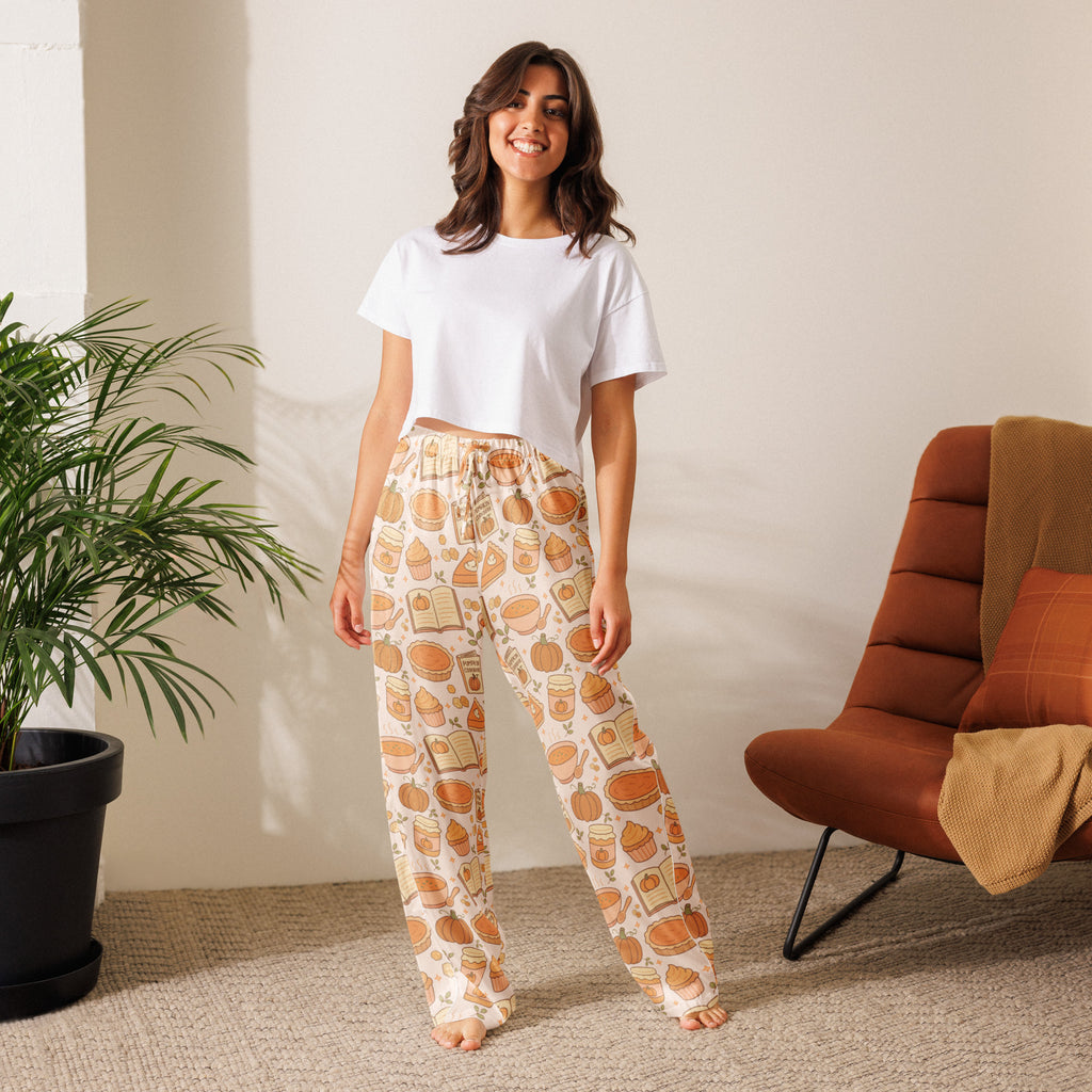 Cream-colored women’s pumpkin pie themed pajama pants with playful autumn pumpkins pies and books pattern and drawstring waist