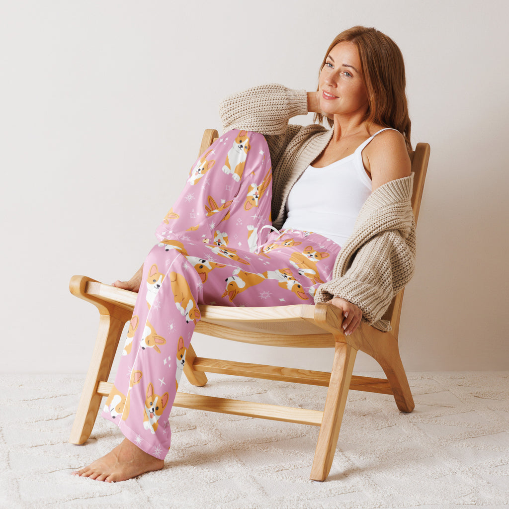 Women’s pink lightweight pajama pants with a relaxed fit and drawstring waist featuring corgi dog and star pattern