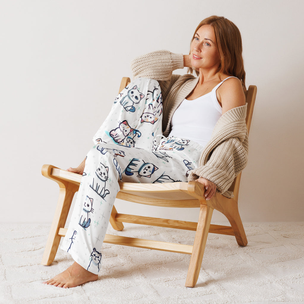 White women’s pajama pants with playful black blue and pink cartoon cat outlines lightweight relaxed fit with drawstring waist