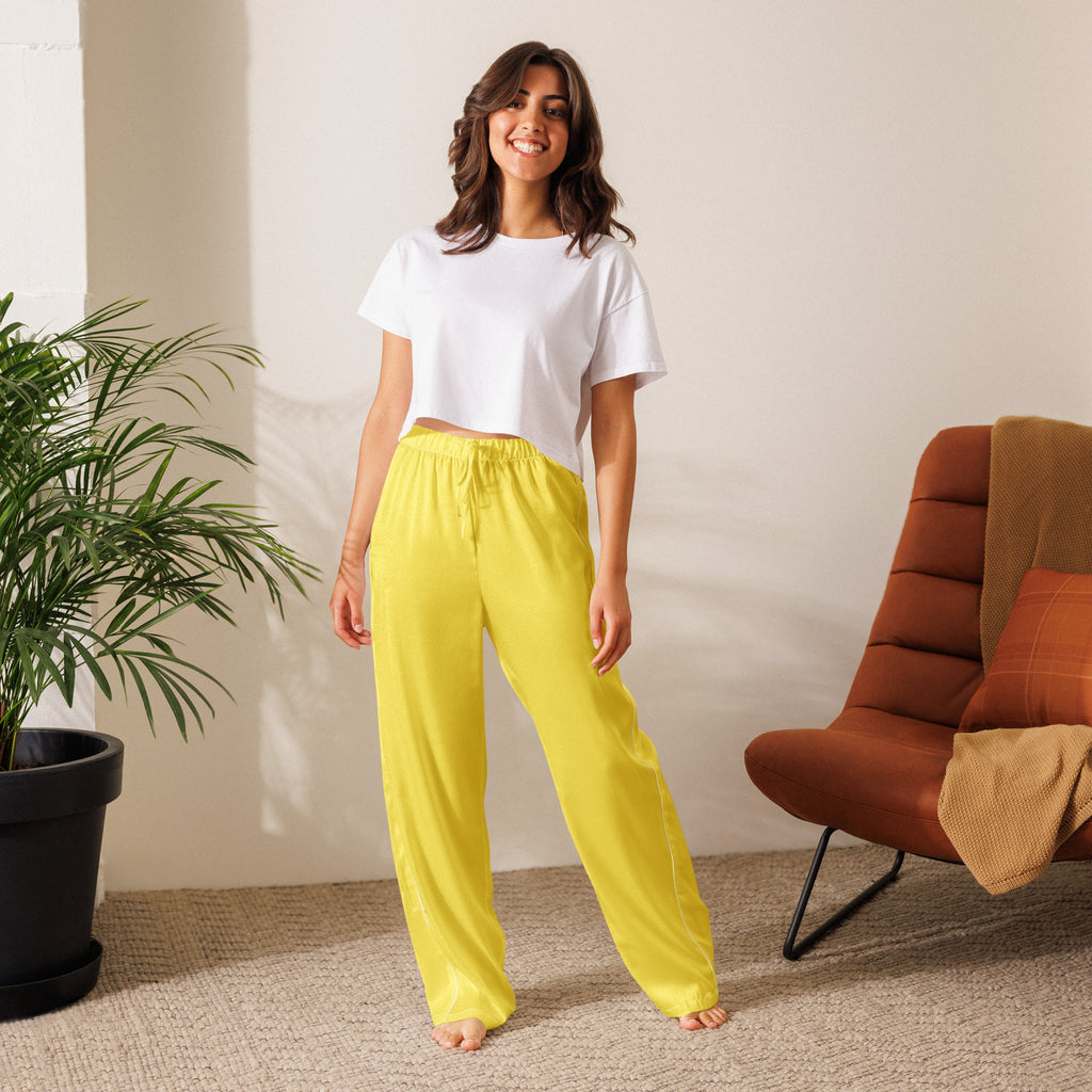Bright yellow satin women’s pajama pants with lightweight relaxed fit and elastic drawstring waistband
