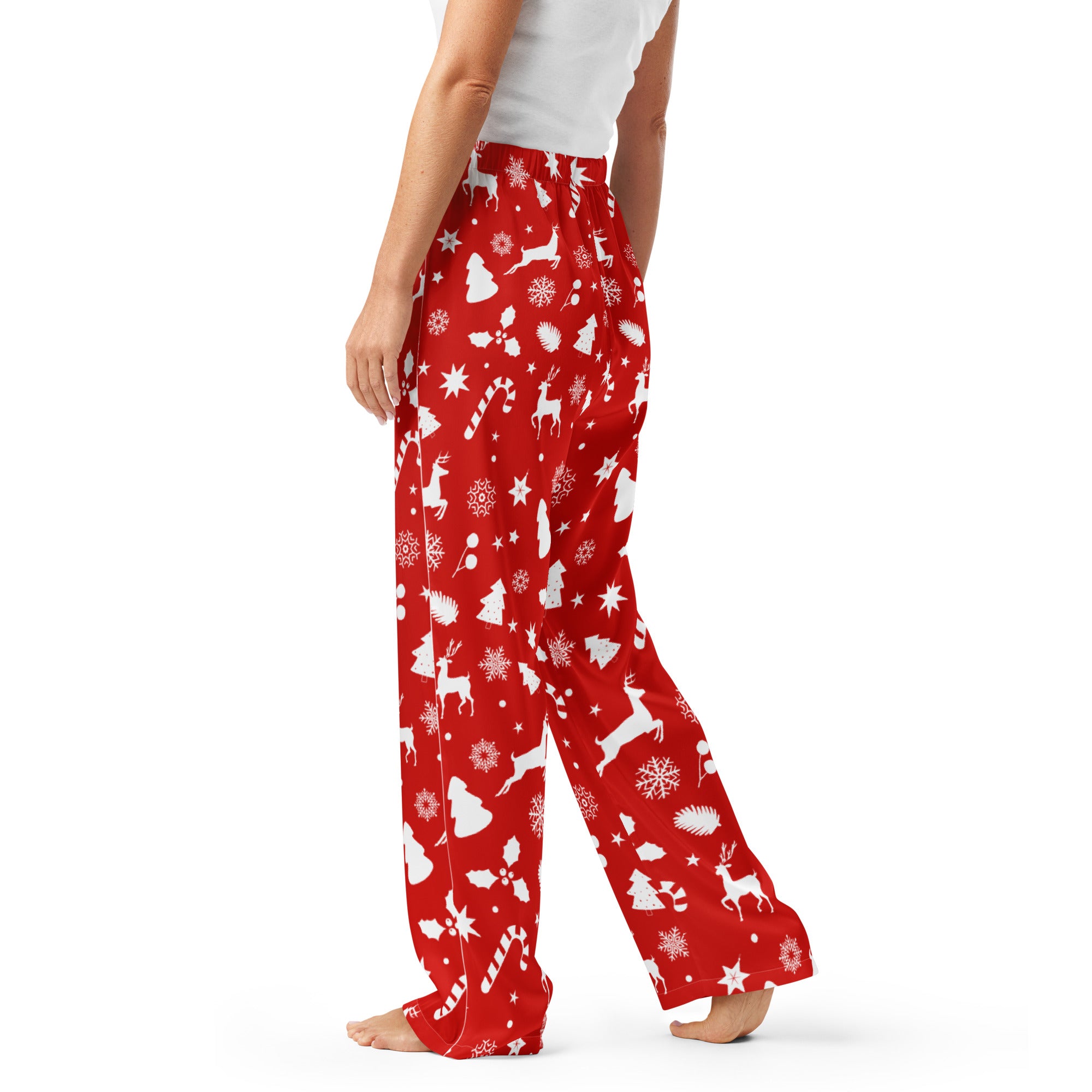 Women’s red lightweight pajama pants with a relaxed fit and festive white holiday pattern for Christmas wear