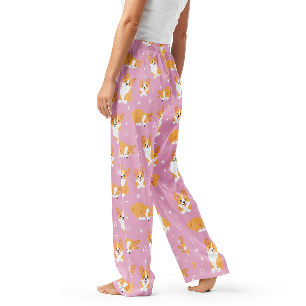 Women’s pink lightweight pajama pants with relaxed fit and drawstring waist featuring tan and white corgi pattern