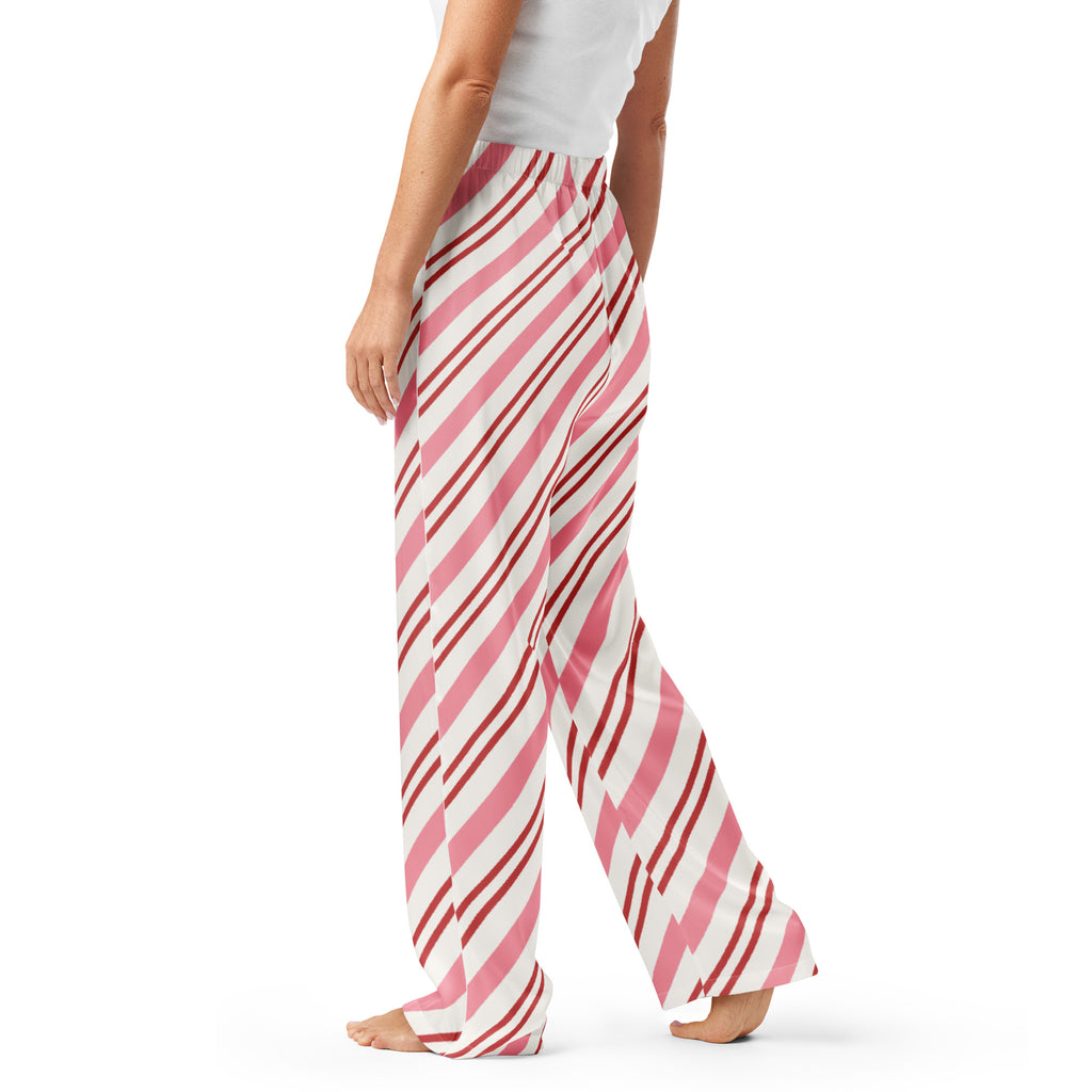 Women’s pink and white candy cane striped wide-leg pajama pants with lightweight fabric and drawstring waist