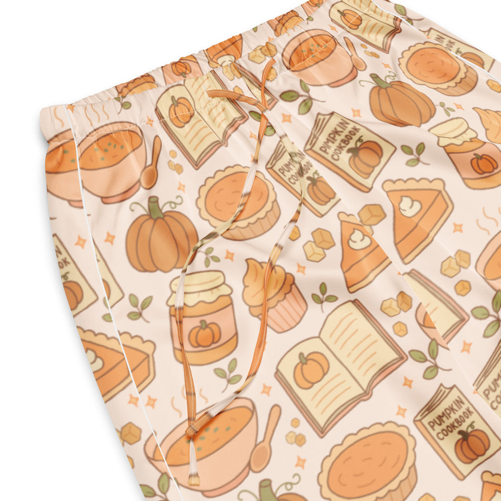 Cream-colored lightweight women’s pajama pants with a relaxed fit and autumn pumpkin pie themed pattern and drawstring waist
