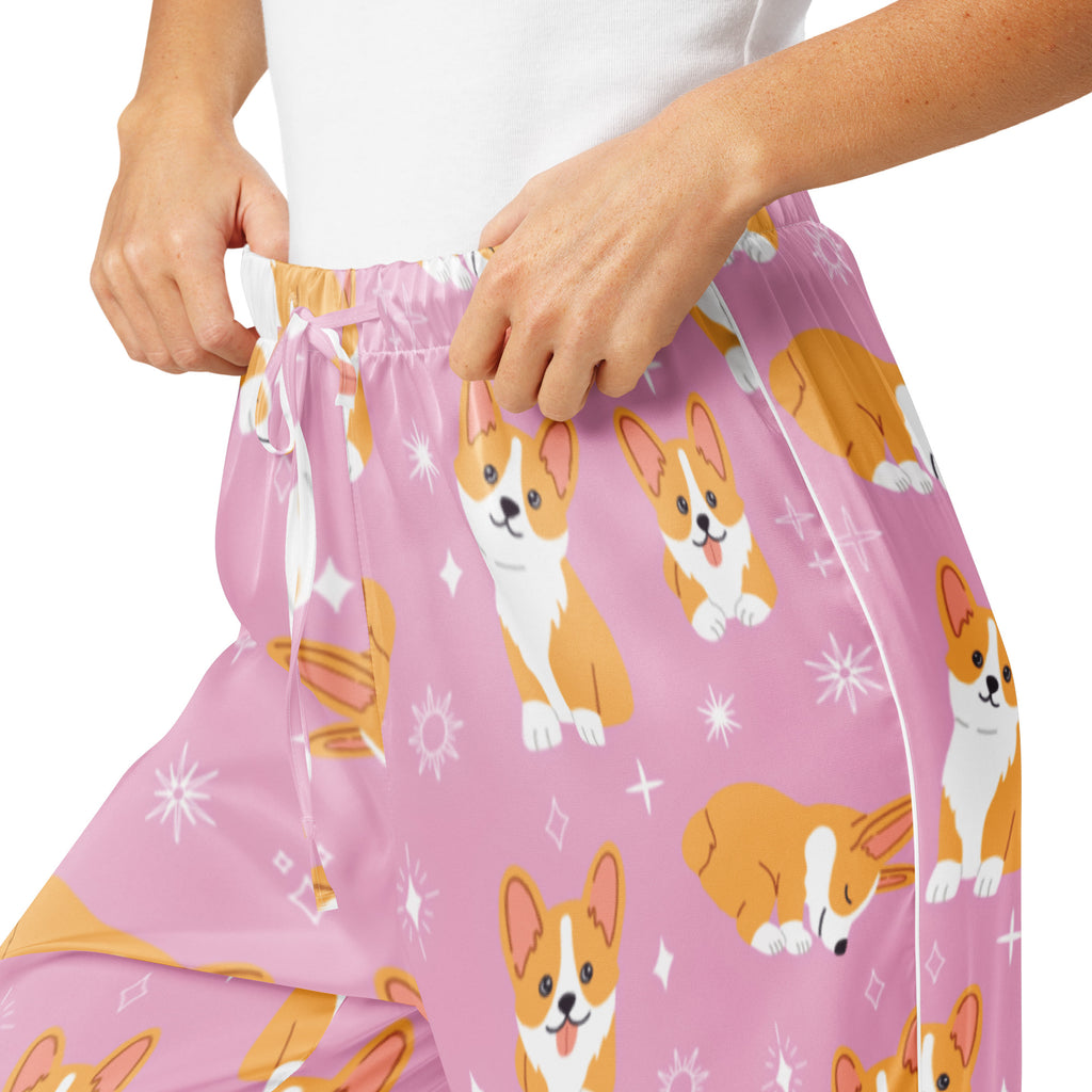 Women’s pink lightweight corgi dog pajama pants with playful orange and white corgis and star accents and drawstring waist