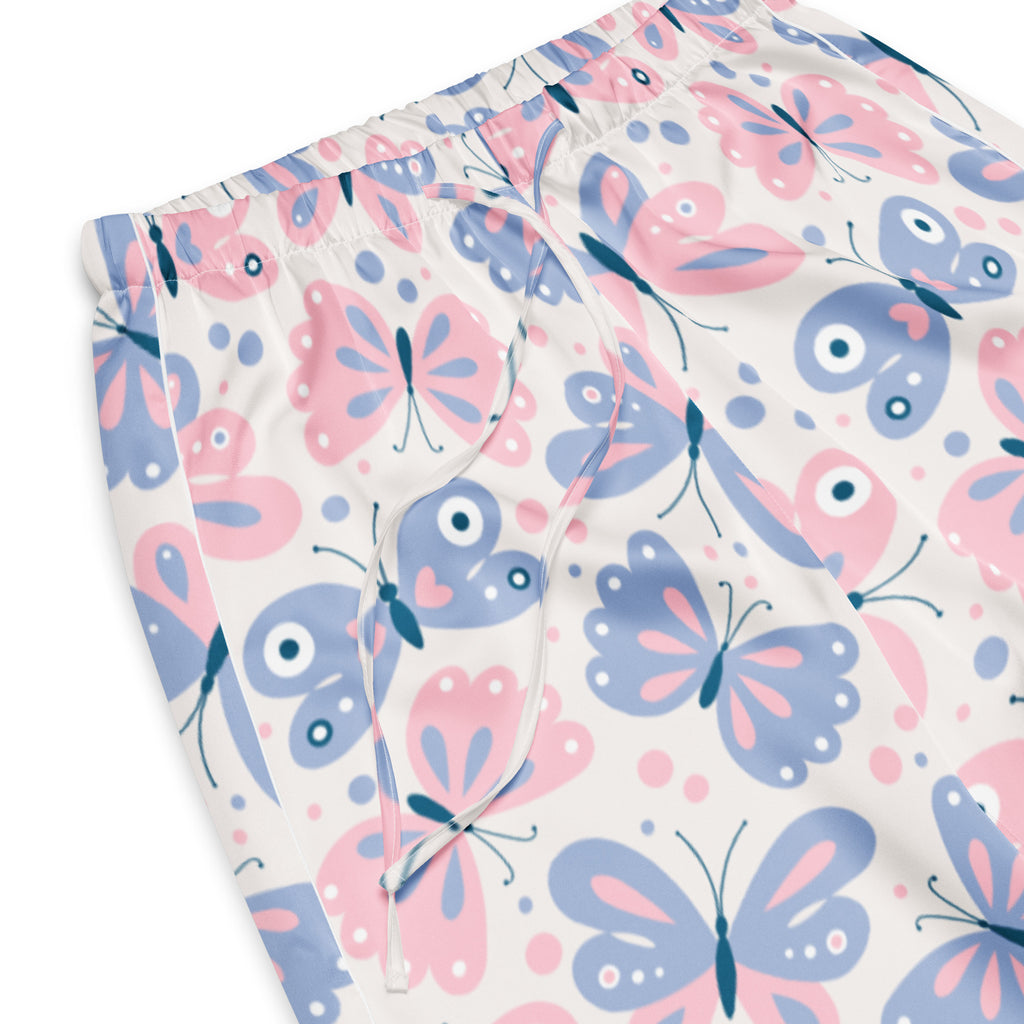 Women’s pastel pink and blue butterfly-patterned pajama pants with lightweight fabric and white elastic waistband