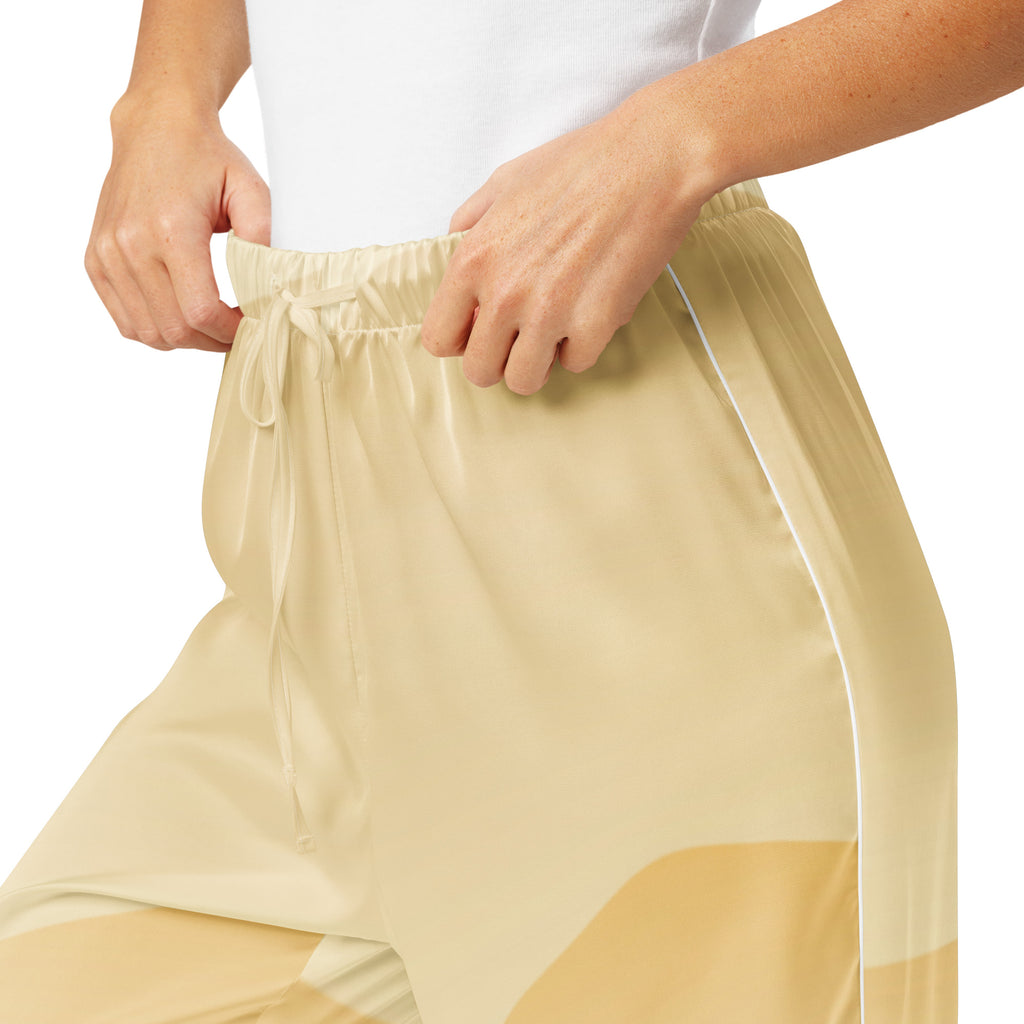 Beige satin women’s ocean sunset pajama pants with drawstring waist and subtle color-blocked panels for lightweight comfort