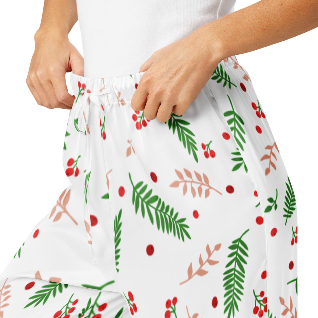 White women’s christmas berry and pine pajama pants with lightweight fabric and festive green leaf red berry pattern