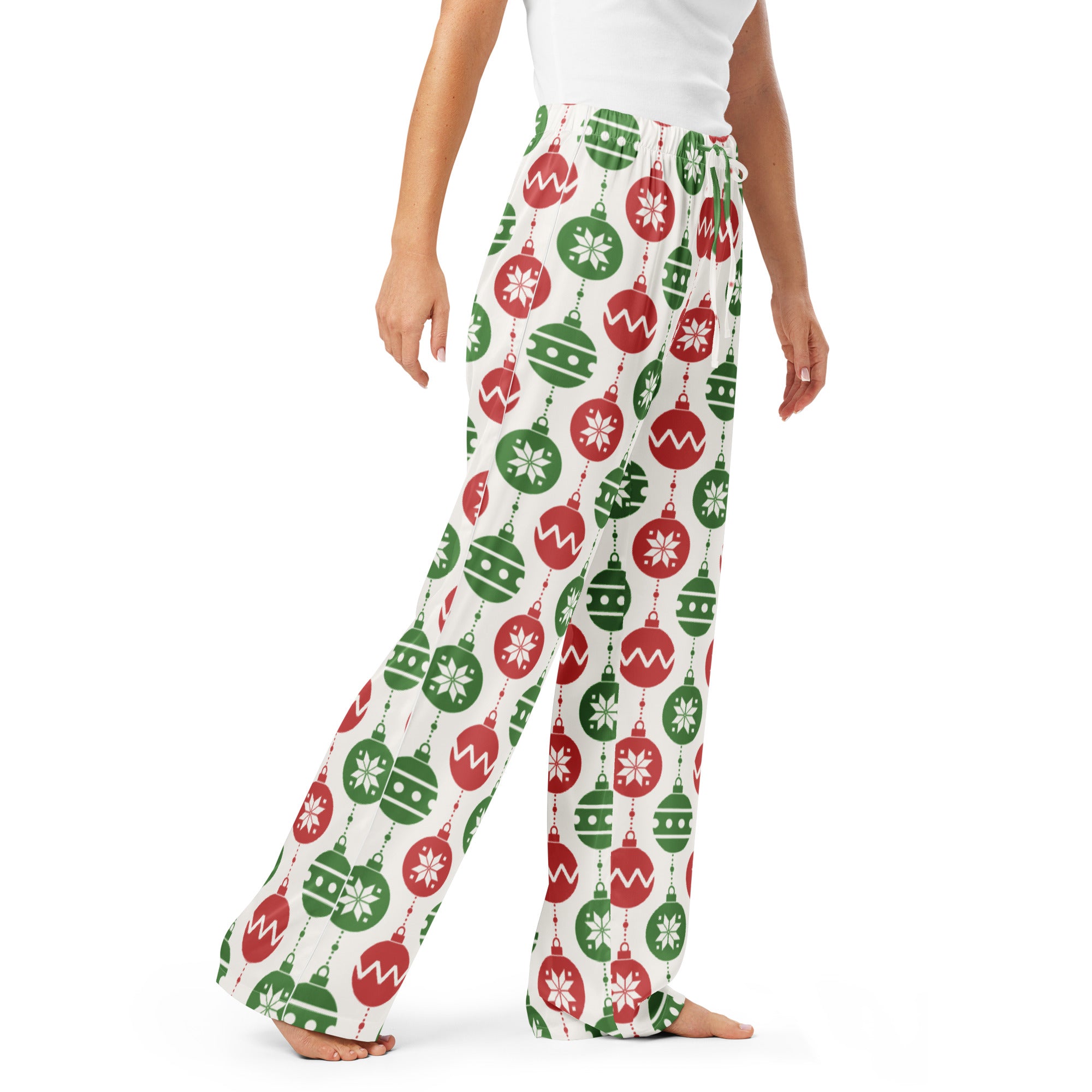 White women’s lightweight pajama pants with a festive red and green christmas ornament pattern and drawstring waist