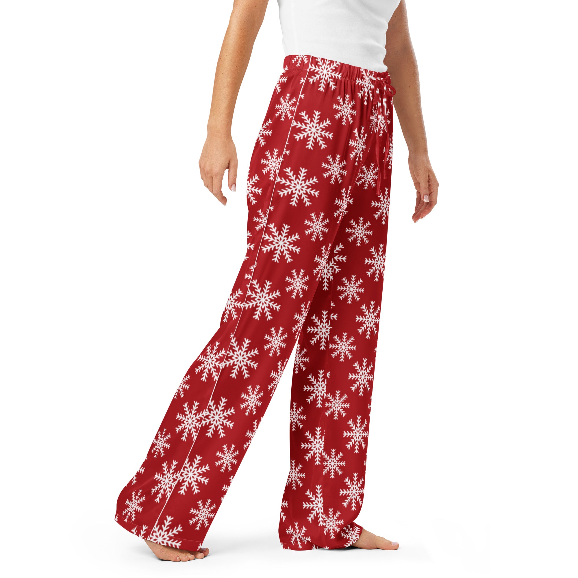 Women’s red lightweight pajama pants with white snowflake pattern and drawstring waist for relaxed fit comfort