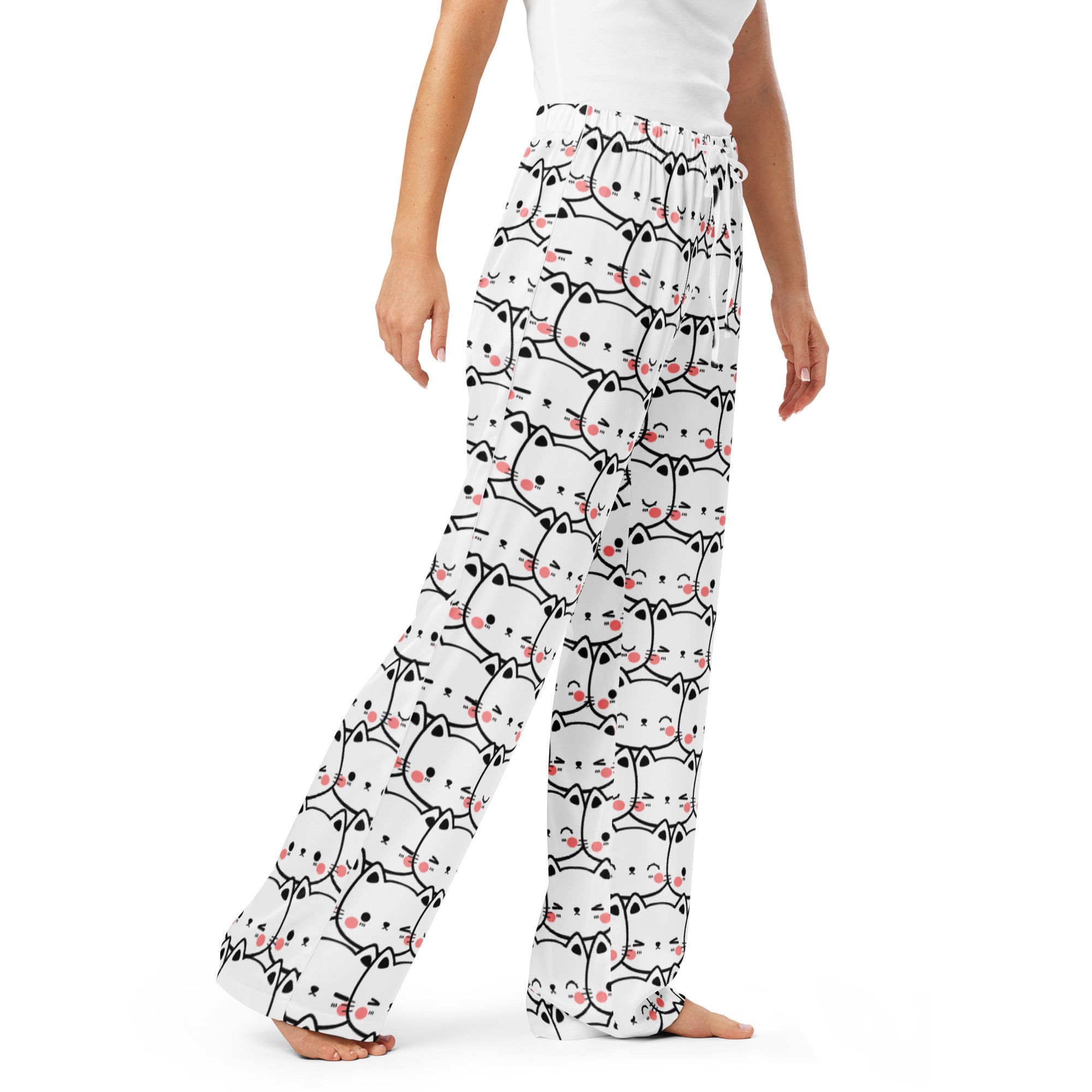 Women’s white lightweight pajama pants with black outlined cartoon cats and pink cheeks featuring a drawstring waist