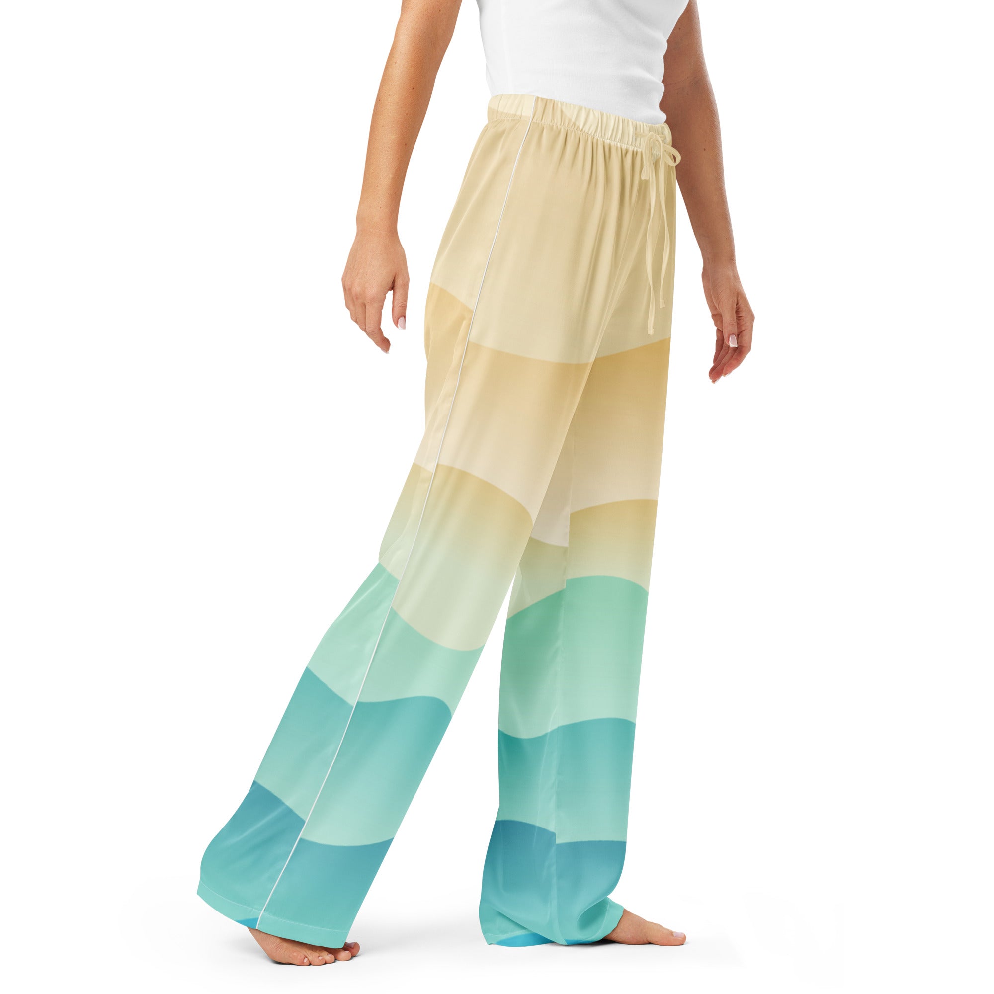 Women’s ocean sunset pajama pants with lightweight fabric, wide-leg fit, gradient from pale yellow to teal, and drawstring waist
