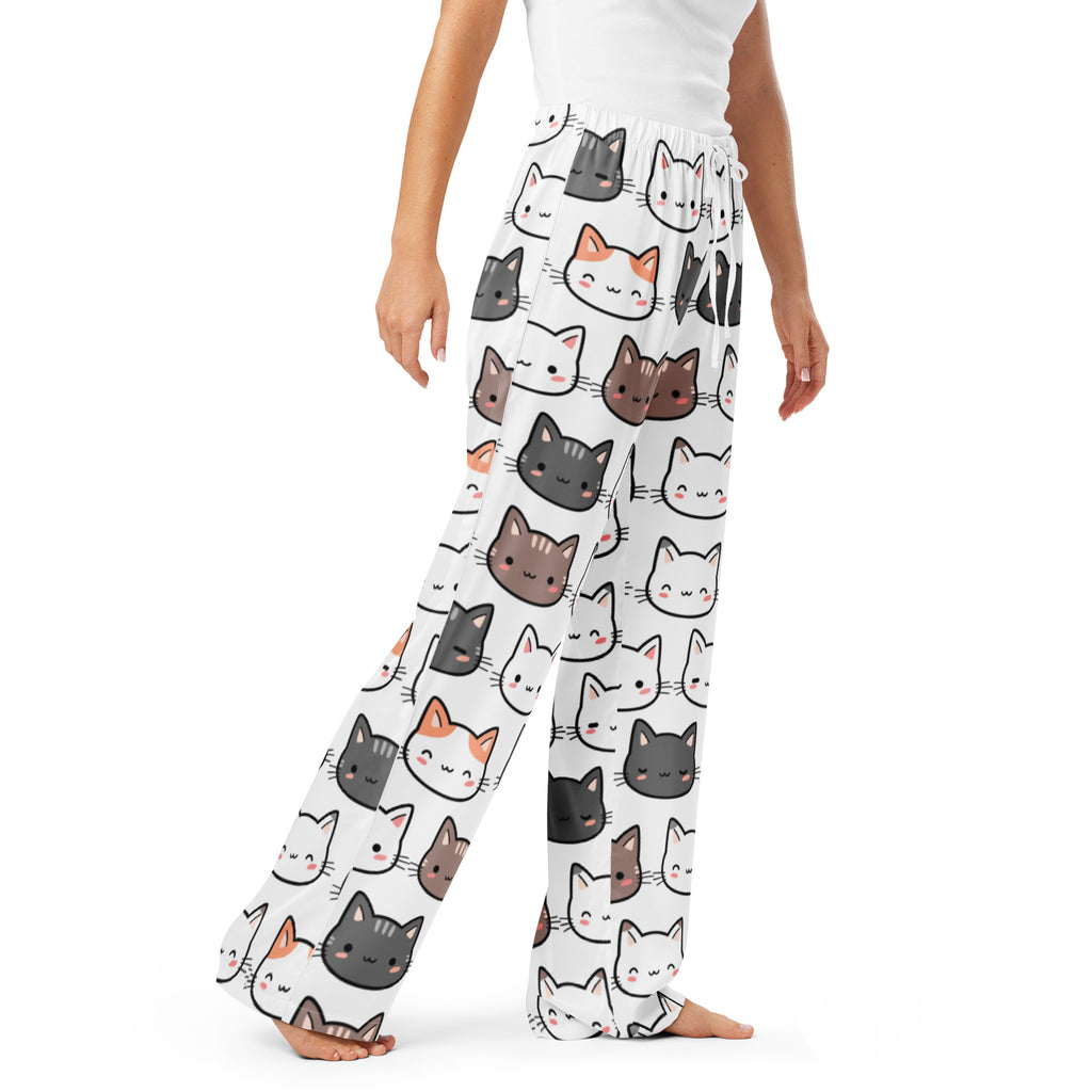 White women’s pajama pants with lightweight fabric and playful multicolor cartoon cat print and drawstring waist