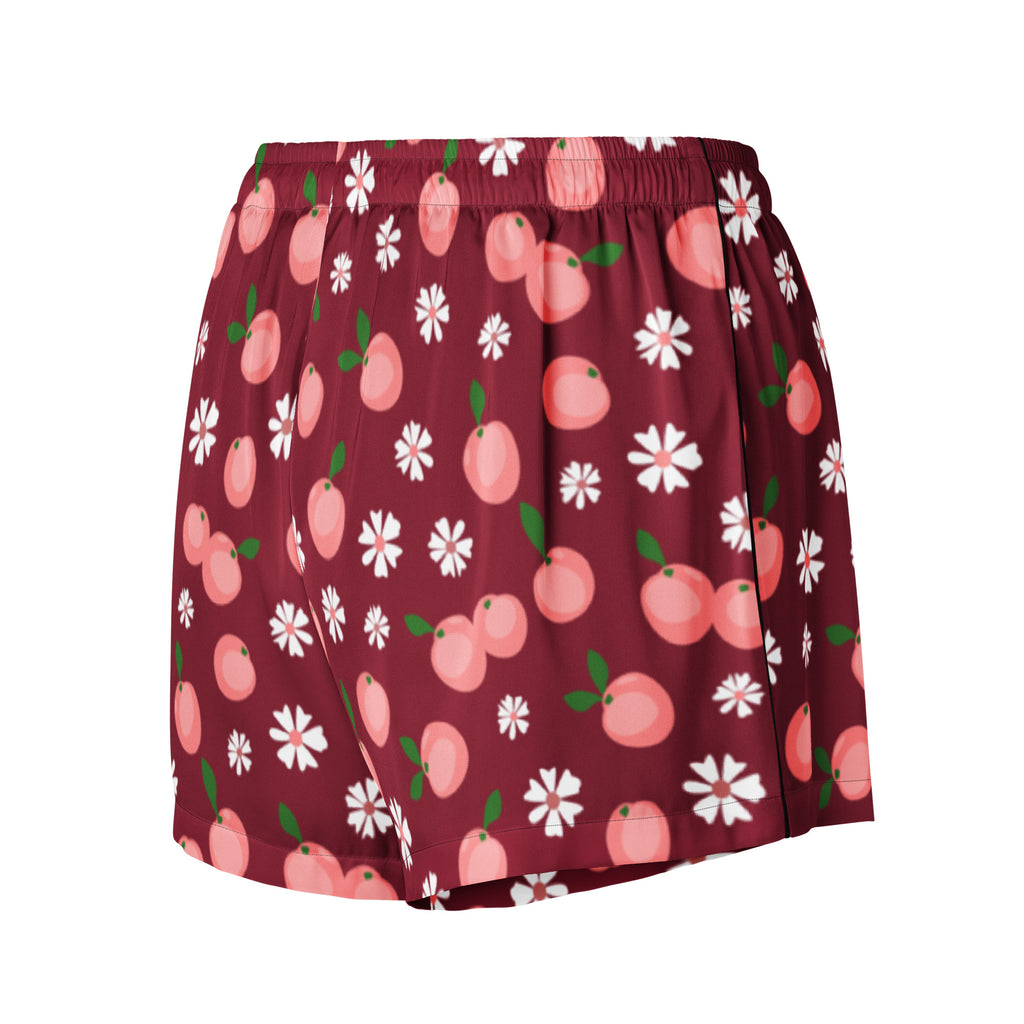 Women’s burgundy peach silky pajama shorts with lightweight relaxed fit and playful pink peach and white daisy pattern