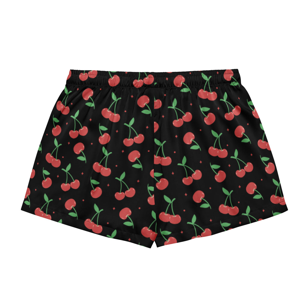 Women’s black silky pajama shorts with a playful red cherry pattern green stems small diamond accents and drawstring waist