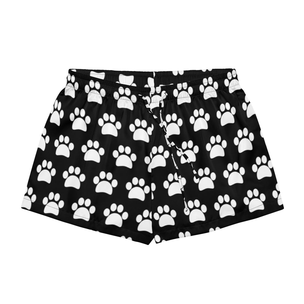 Women’s black silky pajama shorts with white paw print pattern and elastic waistband for lightweight relaxed fit