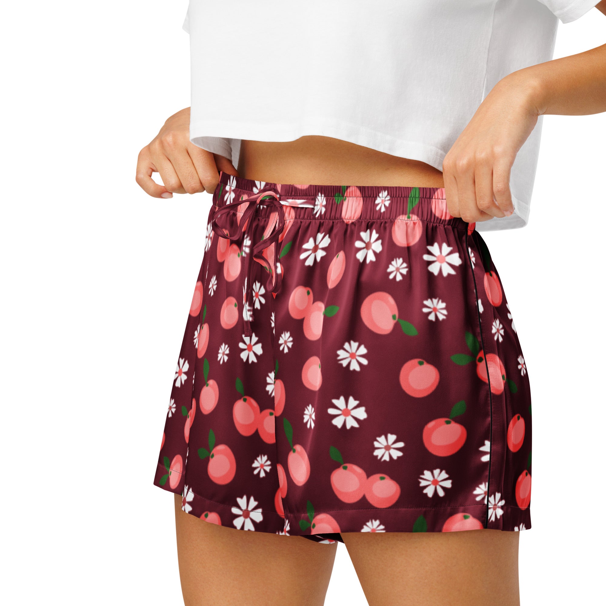 Women’s burgundy peach silky pajama shorts in maroon satin with a playful pink peach and white daisy pattern
