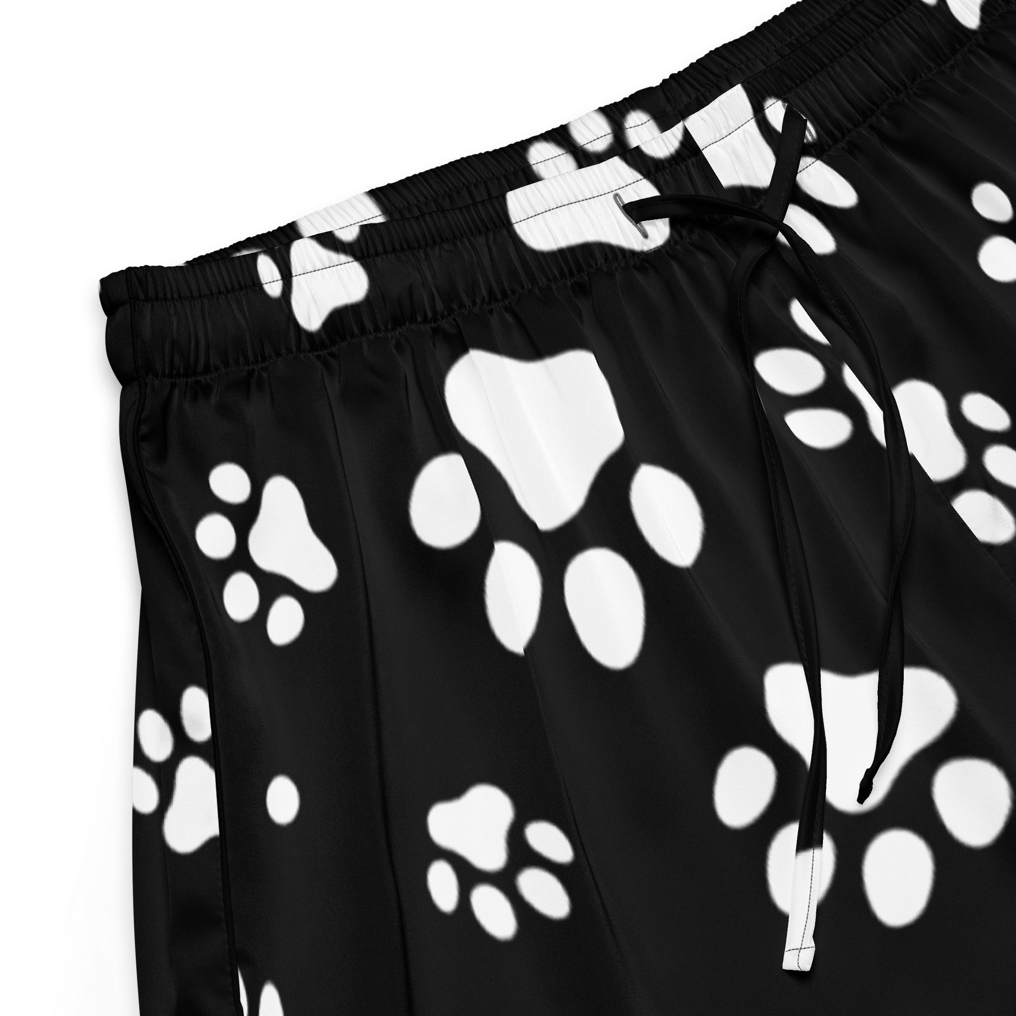 Women’s black silky pajama shorts with white paw print pattern and elastic drawstring waistband for relaxed fit