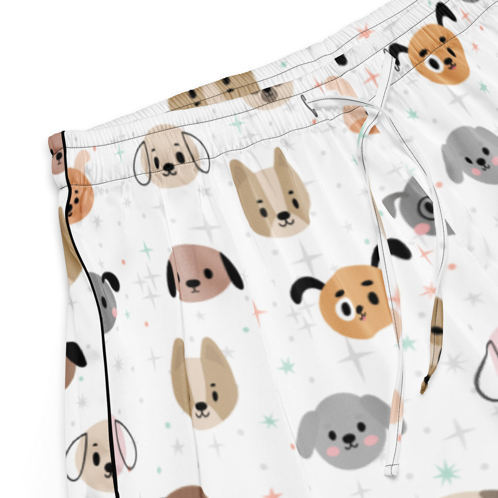 White silky pajama shorts with a playful beige tan and gray cartoon dog face pattern and a drawstring waist