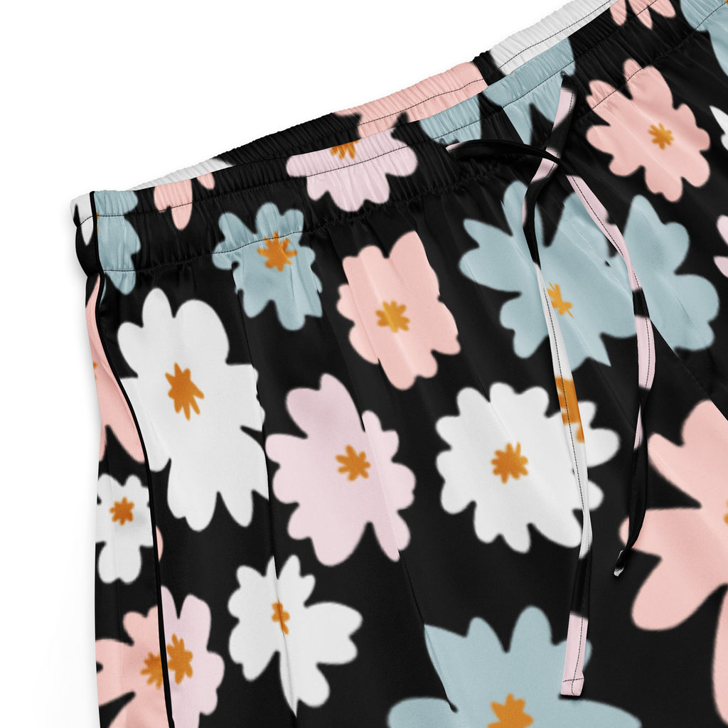 Women’s retro floral silky black pajama shorts with white pink blue blossoms and orange centers lightweight relaxed fit