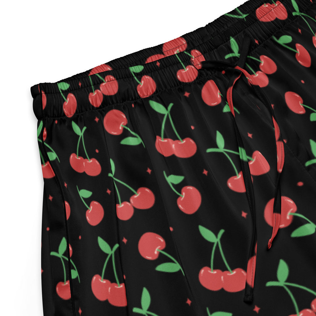 Women’s black silky pajama shorts with lightweight relaxed fit drawstring waist featuring red cherry pattern with sparkles