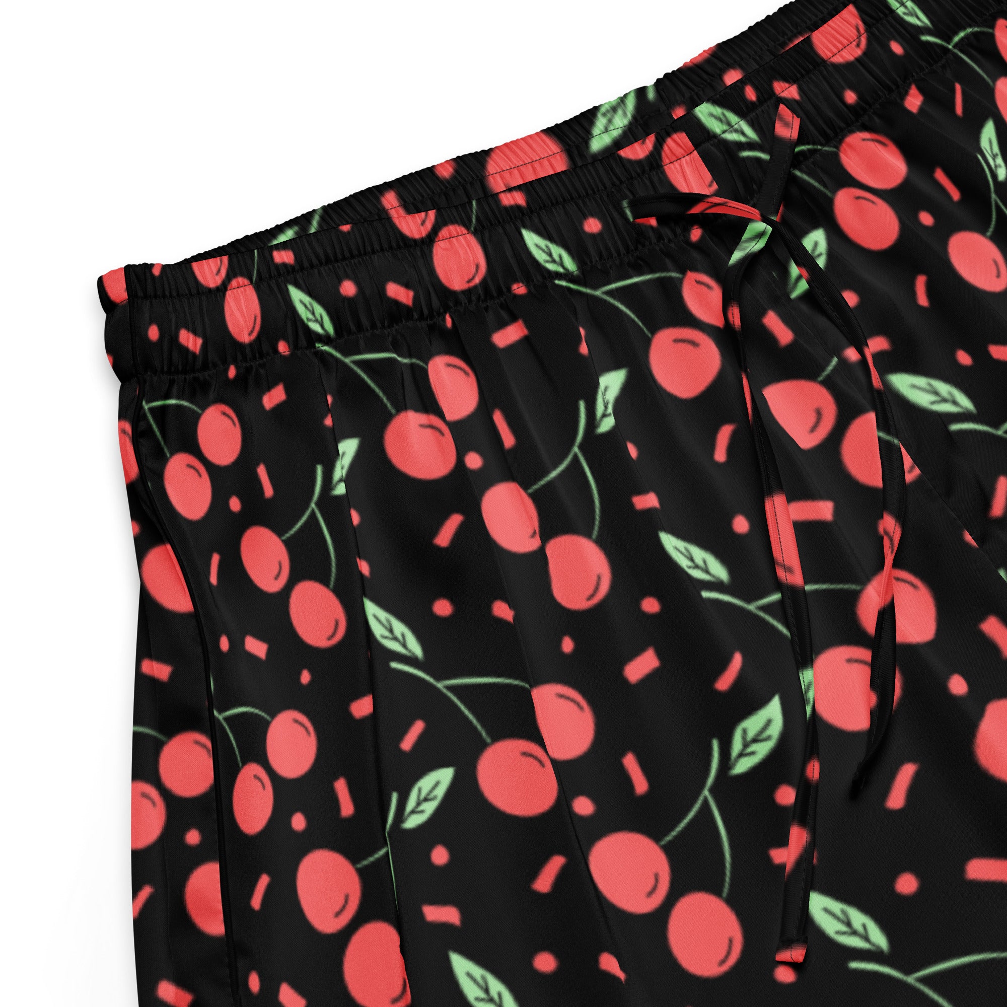Women’s black silky pajama shorts with a playful red cherry confetti pattern and lightweight relaxed fit with drawstring waist