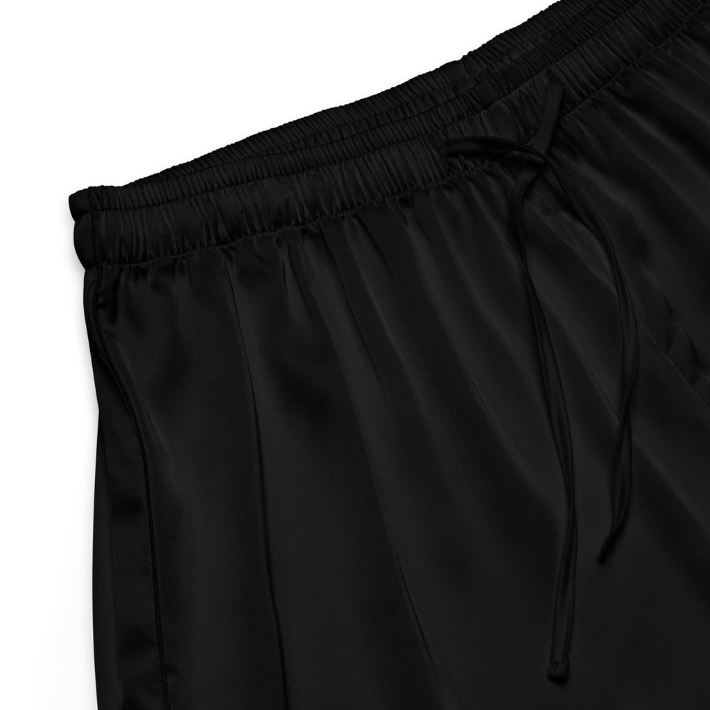 Women’s black silky pajama pants in satin with an elastic waistband and matching drawstring for lightweight comfort